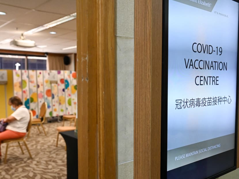 A woman waiting to receive a Covid-19 vaccine at the Mount Elizabeth Hospital vaccination centre.