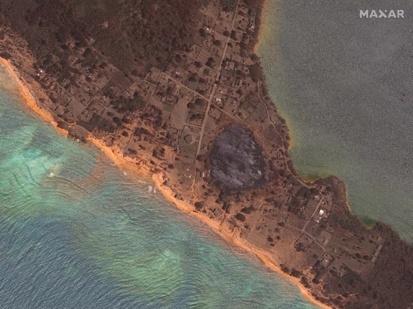 This satellite image released by Maxar Technologies on January 22, 2022 and taken on January 20, 2022 shows a closeup of damaged homes located on Nomuka Island in Tonga, following the eruption of the Hunga Tonga-Hunga Ha’apai volcano.