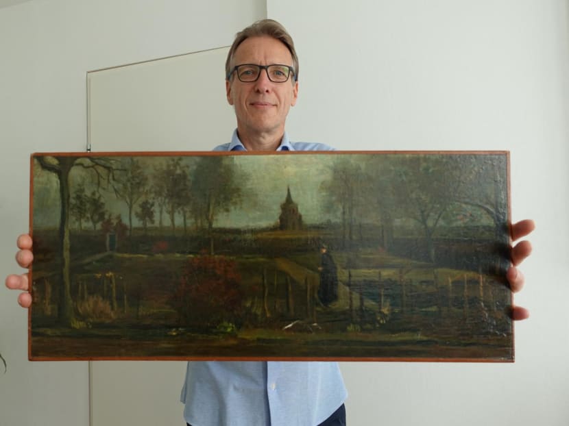 A handout picture released by Dutch art detective Arthur Brand shows a portrait of him posing with the painting titled "Parsonage Garden at Nuenen in Spring", painted by Vincent van Gogh in 1884, at his home in Amsterdam on Sept 11, 2023. 