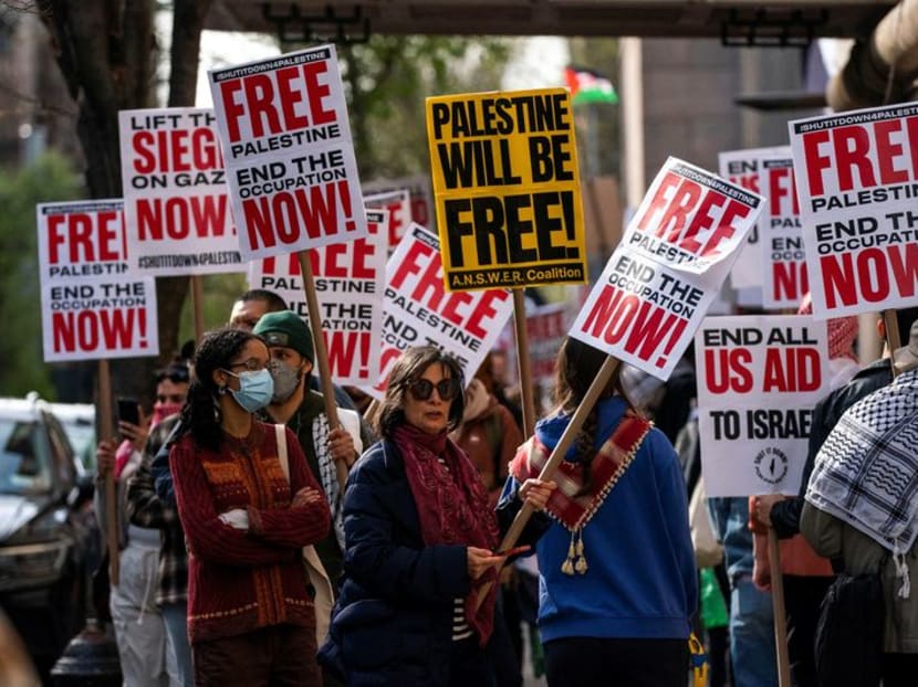 People demonstrate outside Columbia University, during the ongoing conflict between Israel and the Palestinian Islamist group Hamas, in New York City, US, April 23, 2024. 