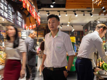 Mr Jensen Low (centre) was mentioned in the 2024 National Day Rally speech by Prime Minister Lawrence Wong. 