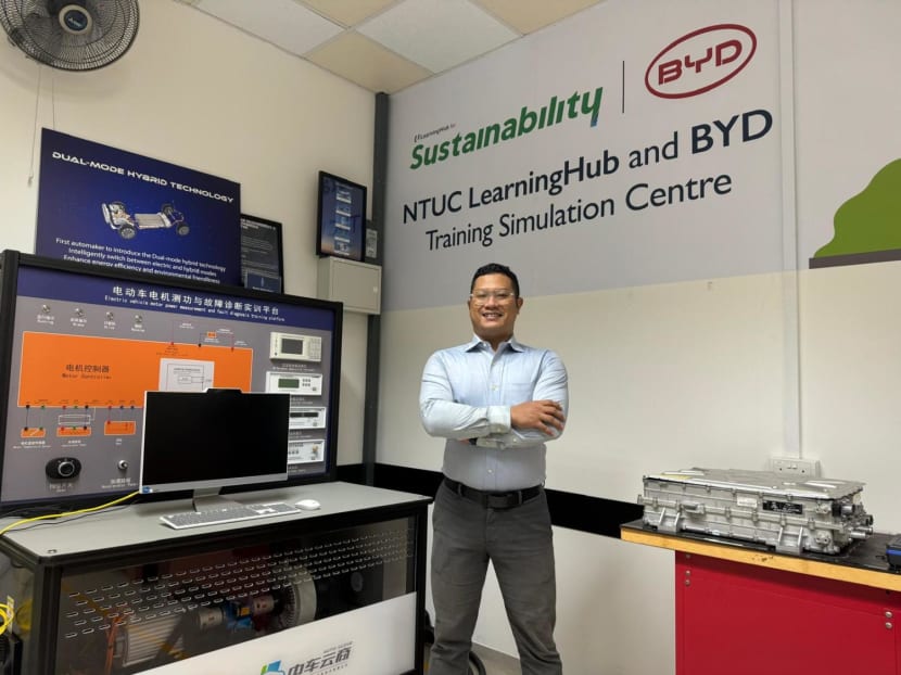 Mr Rusydi Maswan finds his skill set in high demand after acquiring competencies in electric and hybrid vehicle charging, maintenance and battery management. Photos: NTUC LearningHub