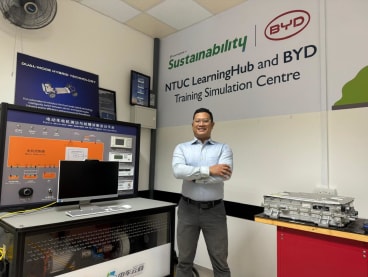 Mr Rusydi Maswan finds his skill set in high demand after acquiring competencies in electric and hybrid vehicle charging, maintenance and battery management. Photos: NTUC LearningHub