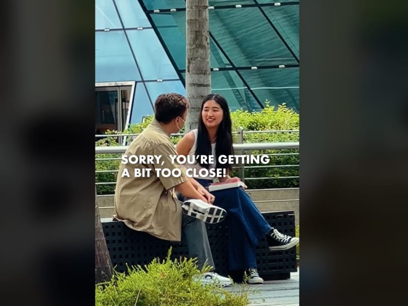 A screenshot from a "social experiment" of a staged incident of a woman being harassed by a man near Marina Bay Sands.